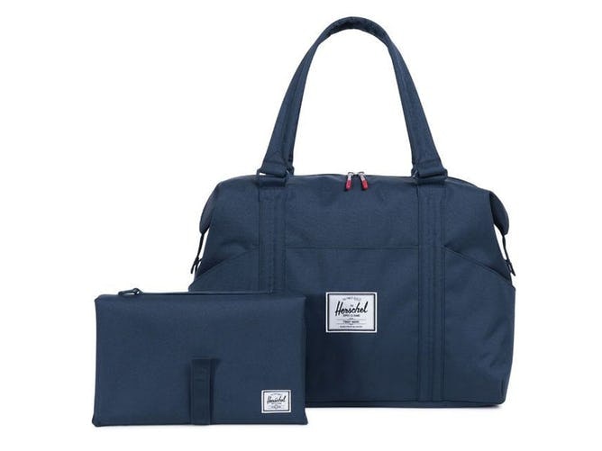 Blå pusletaske fra Herschel.